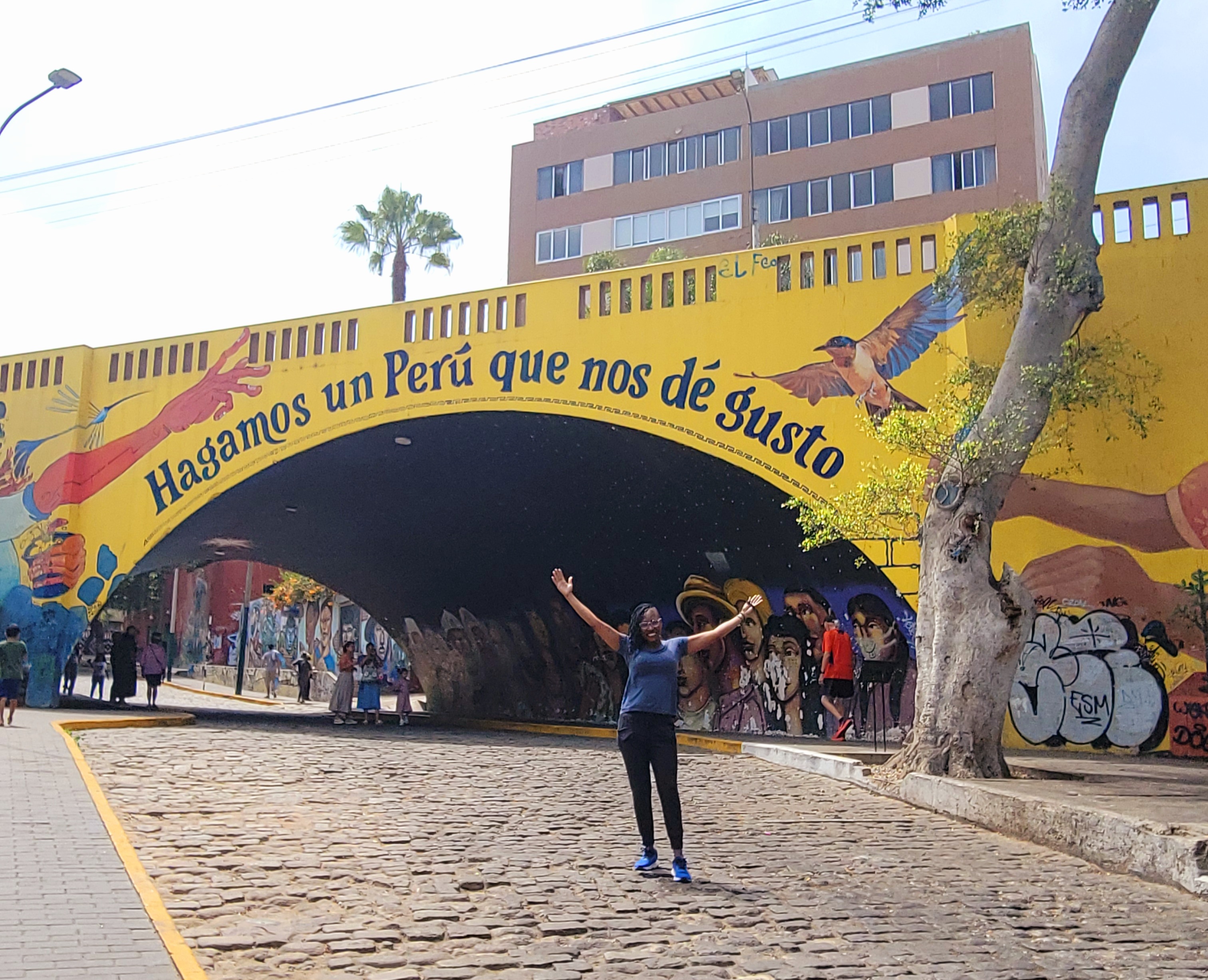 Sandra, Tax Strategist and IRS Enrolled Agent, smiling outdoors with a scenic background, representing her expertise and digital nomad lifestyle.